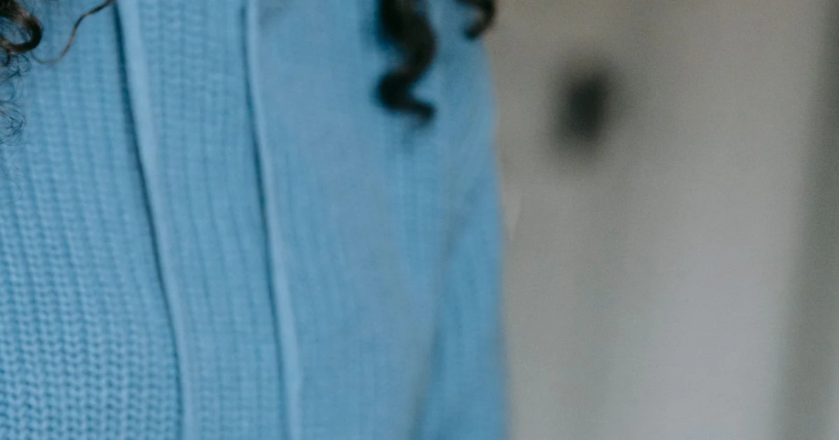 Blue crocheted fabric showing rows of small, even stitches.